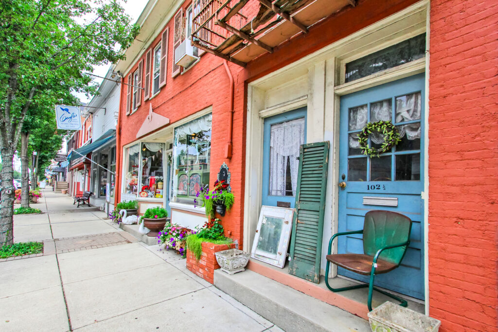Colorful brick storefronts and local shops in historic downtown Milford, Ohio.